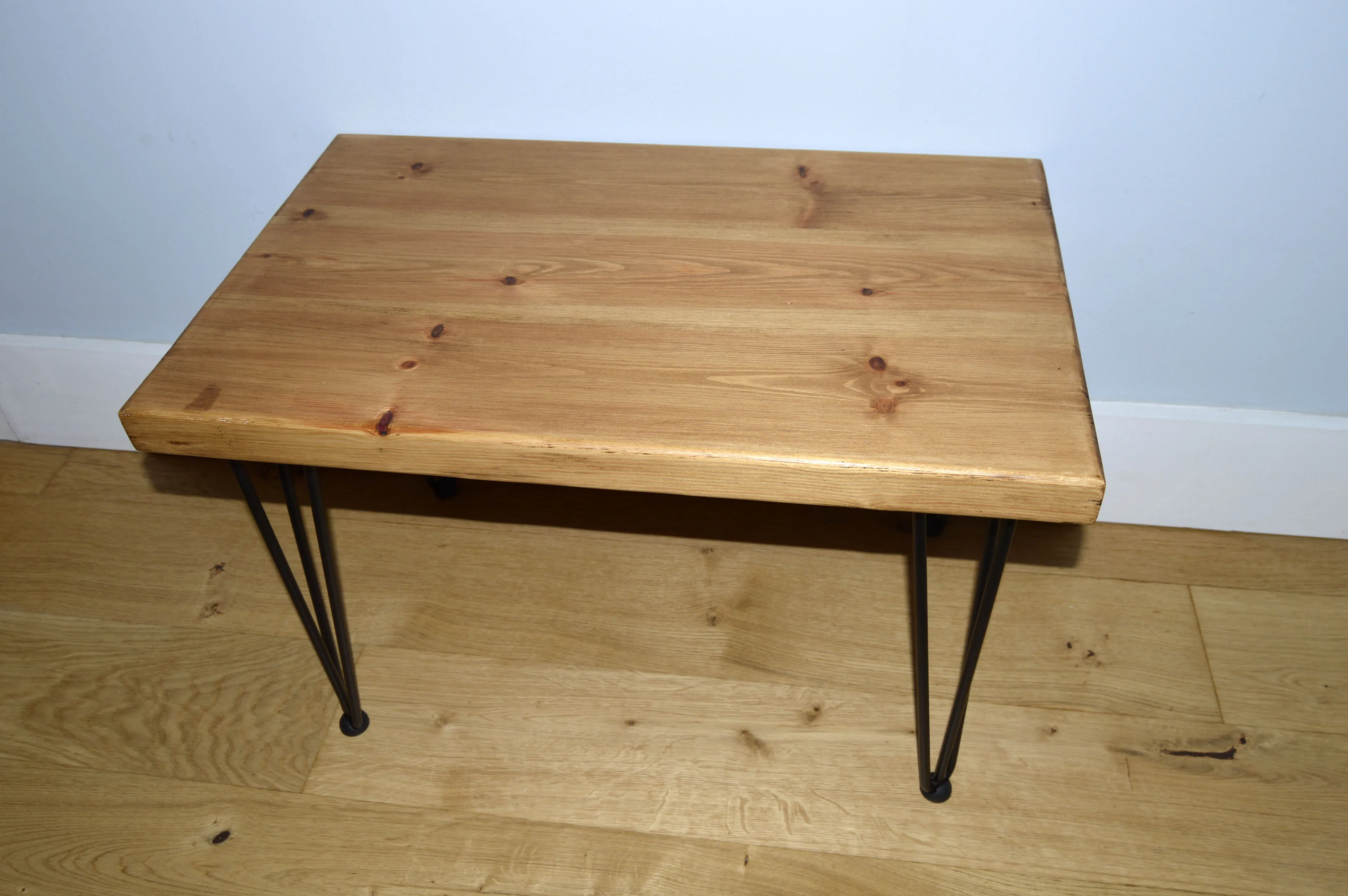 Chunky Redwood coffee table with Black hairpin steel legs