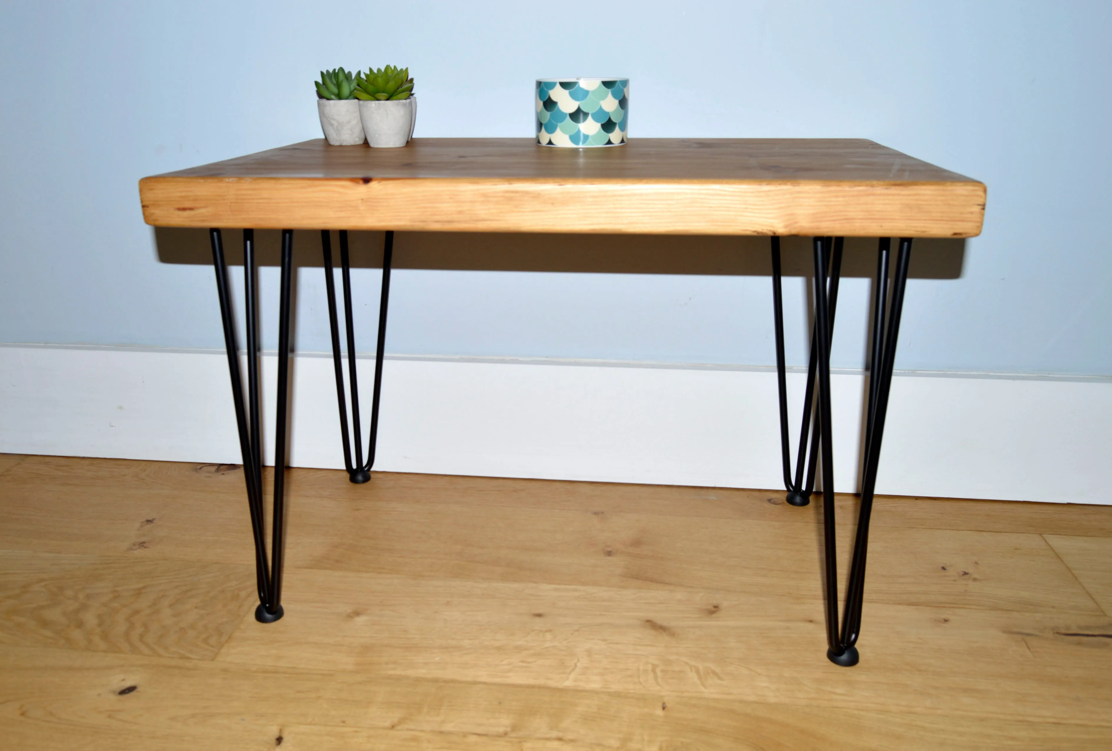 Chunky Redwood coffee table with Black hairpin steel legs