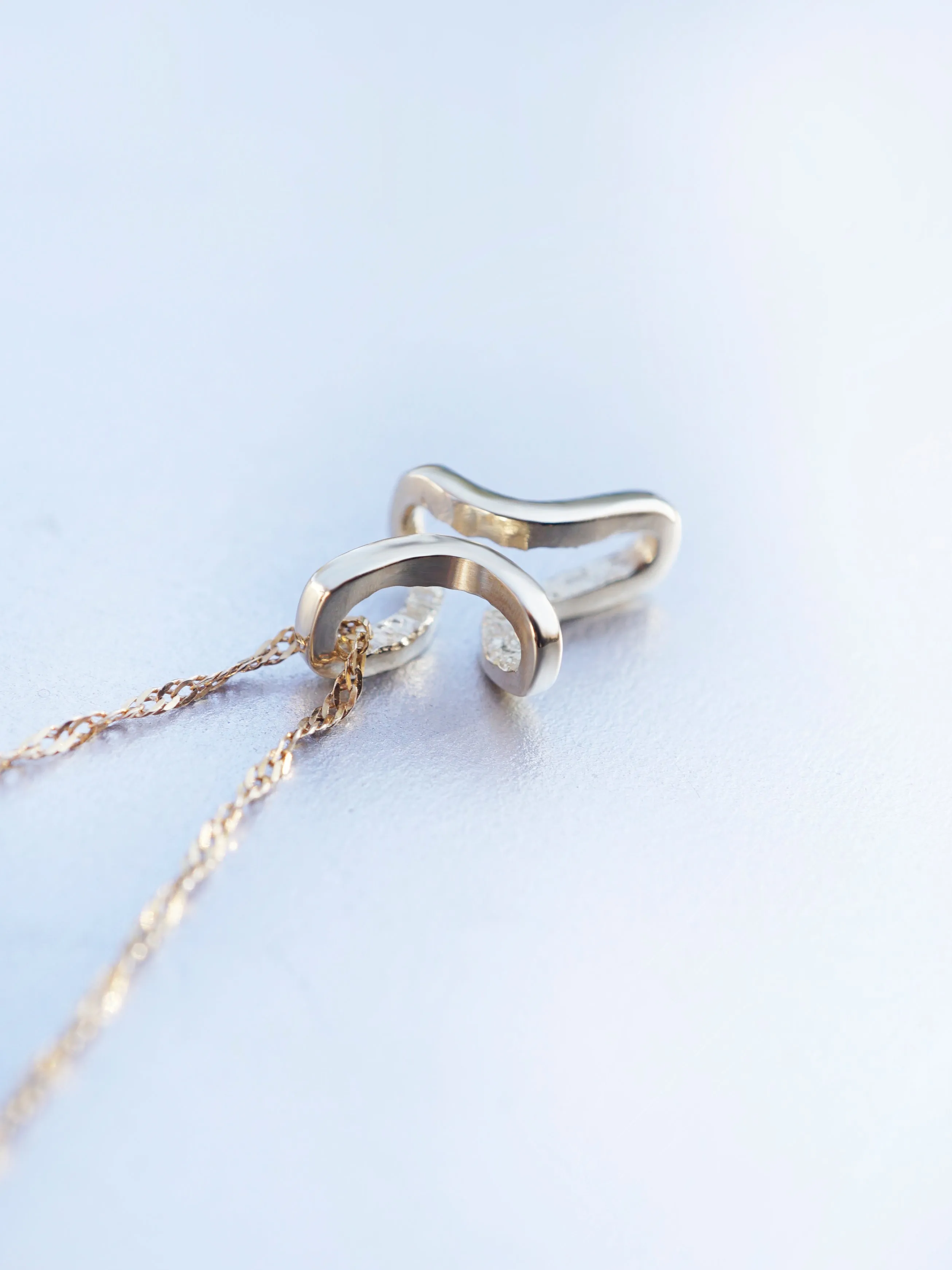 INFINITY | gold cross pendant