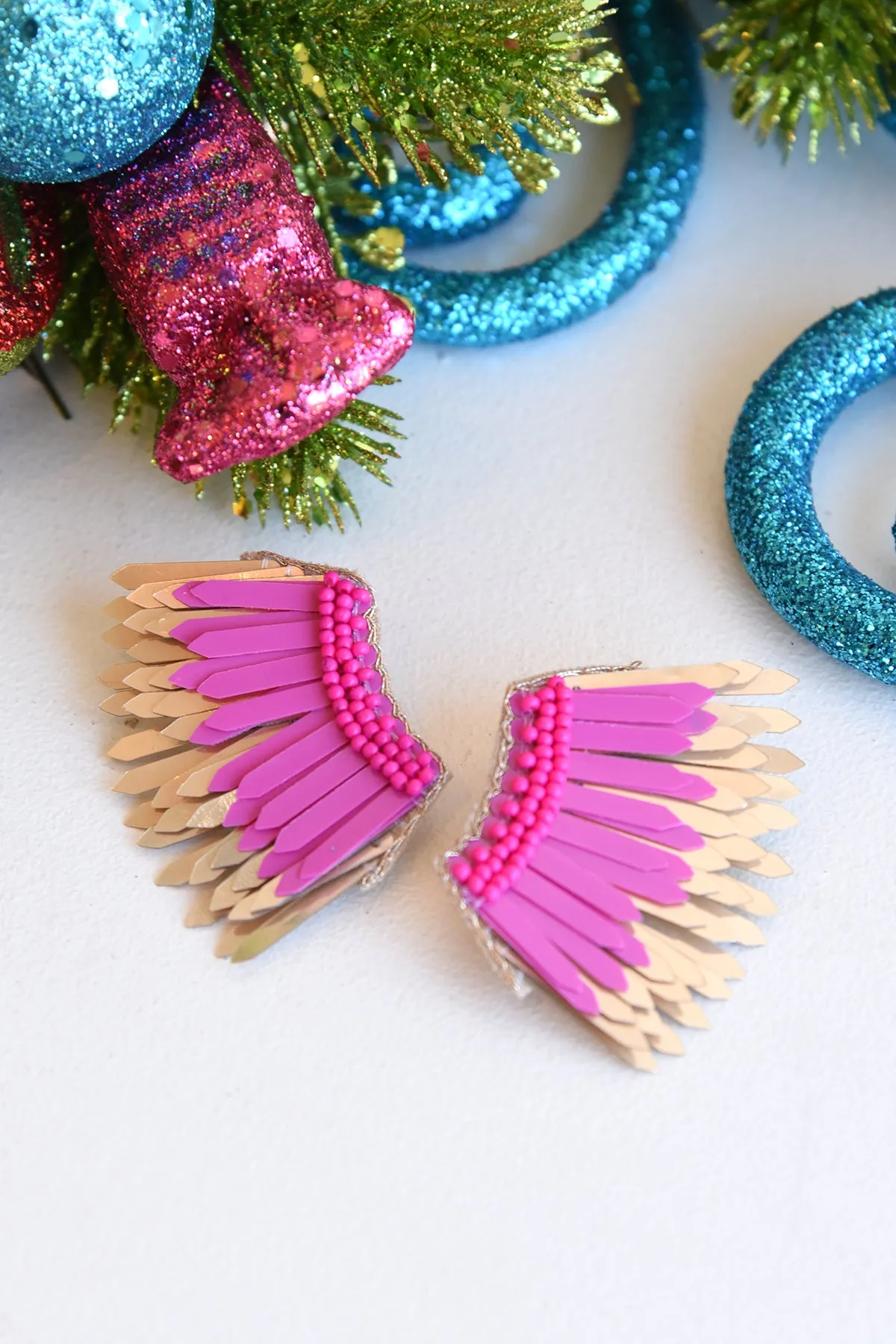 PINK WING STUD EARRINGS