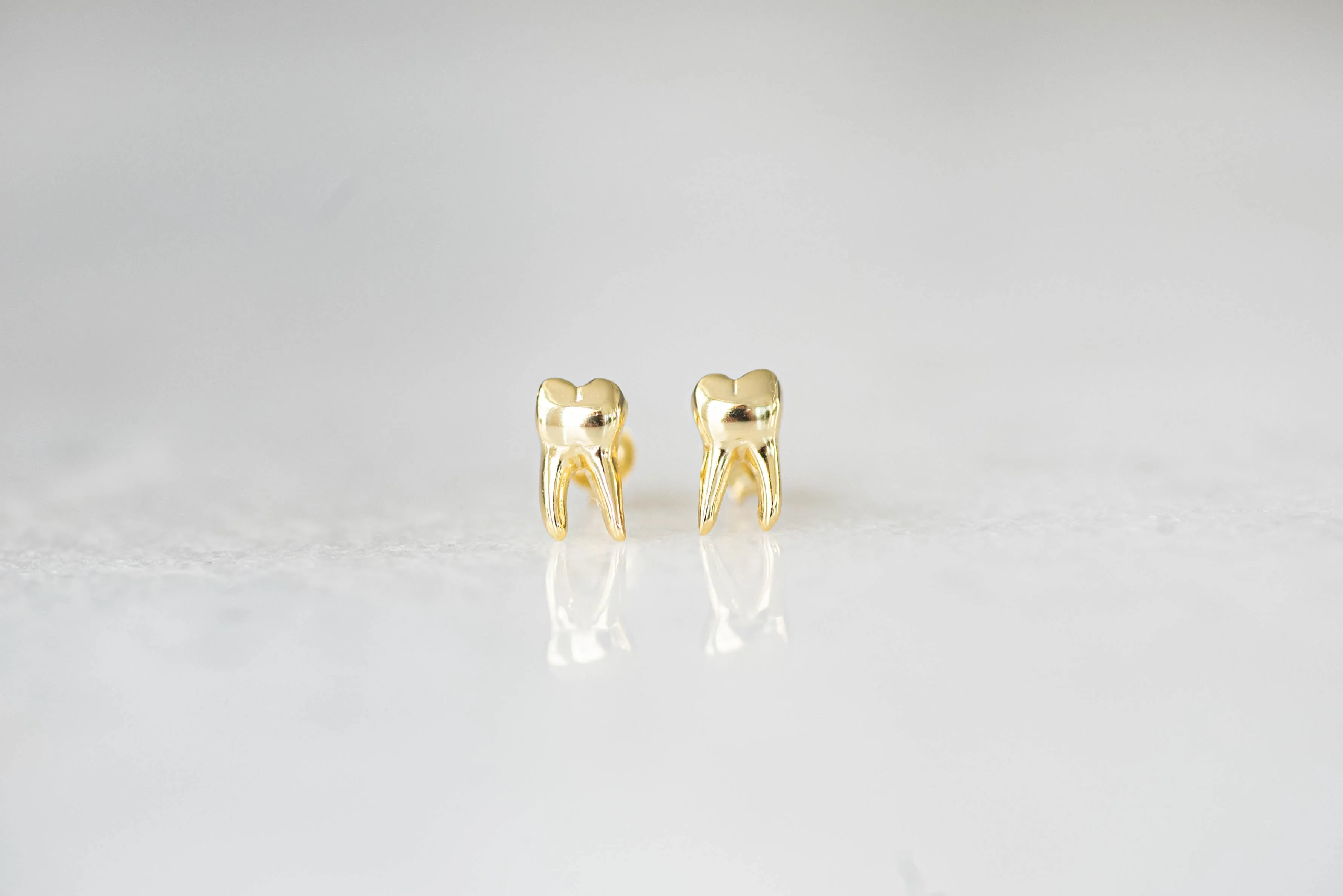 Tooth stud earrings