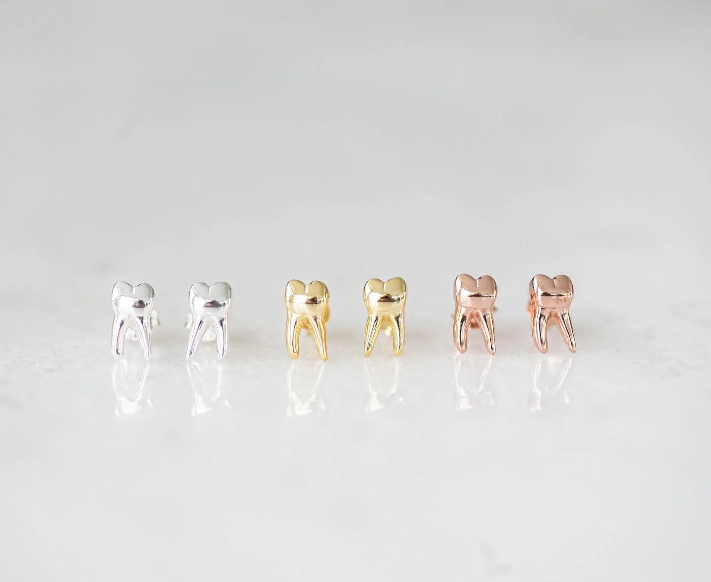 Tooth stud earrings