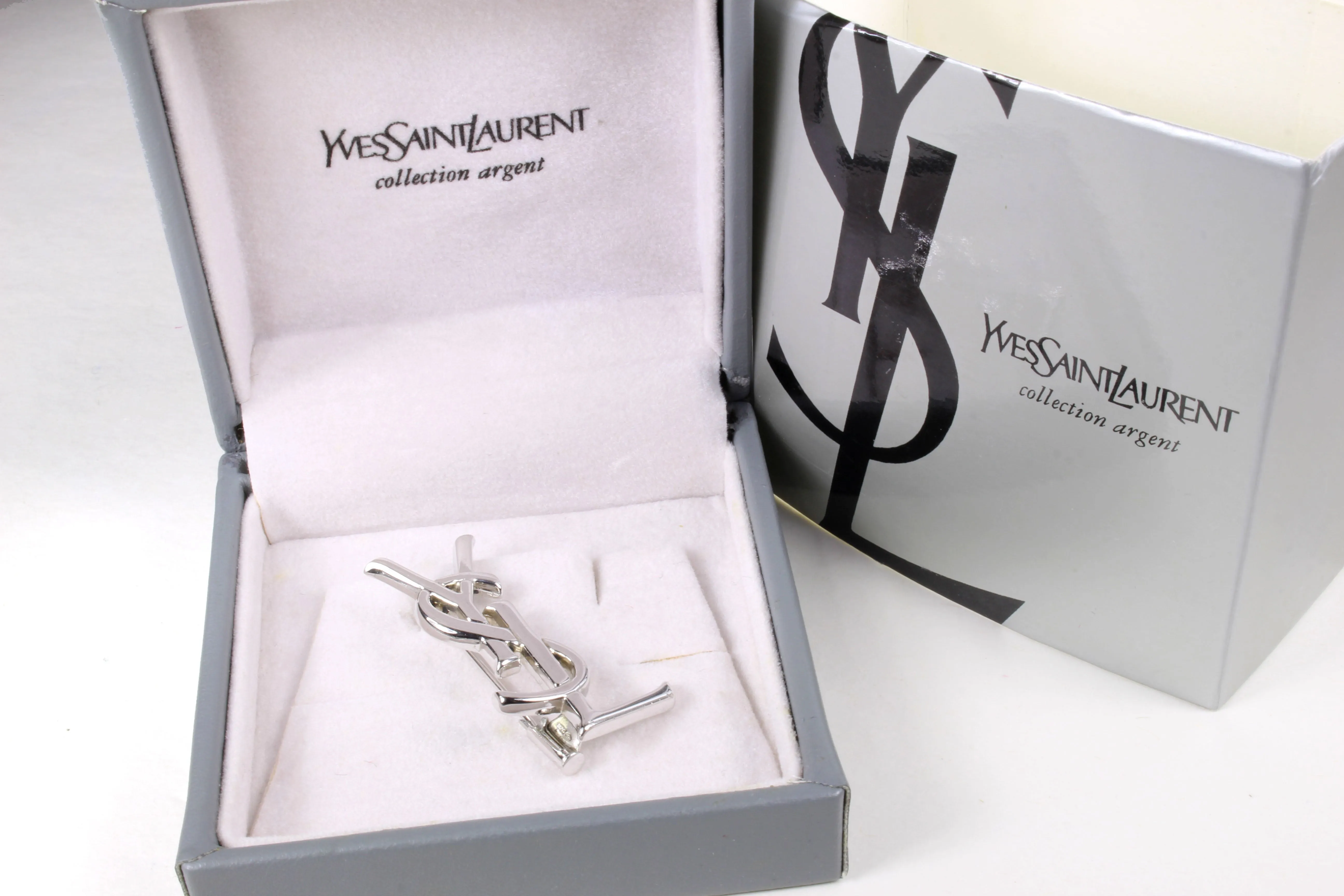 YVES SAINT LAURENT Logo silver brooch